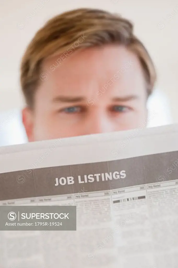 Man reading job listings
