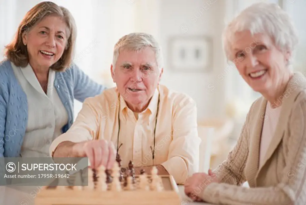 Senior adults playing chess