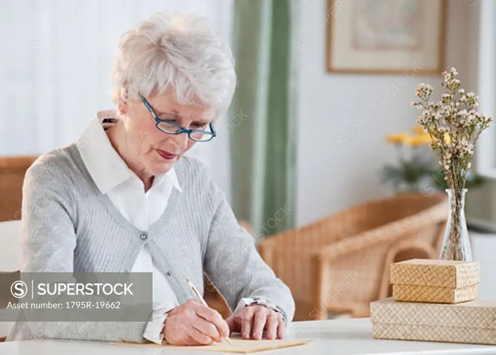 Senior woman writing letter