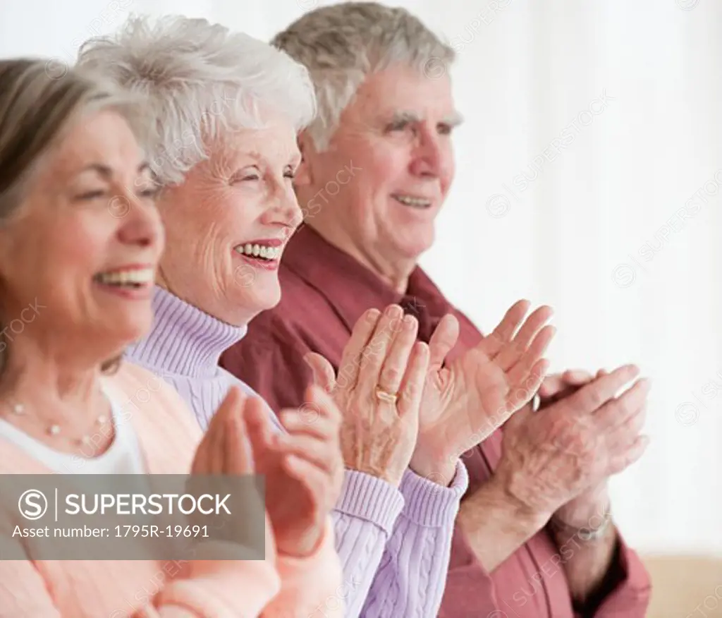 Senior adults clapping