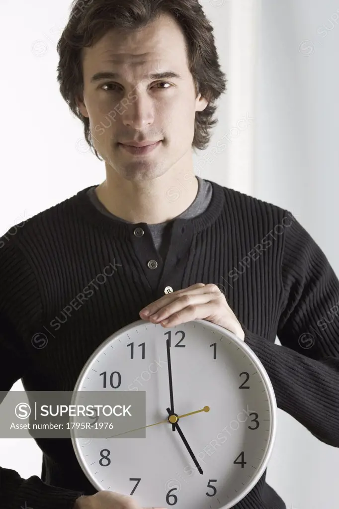 Closeup of man with clock