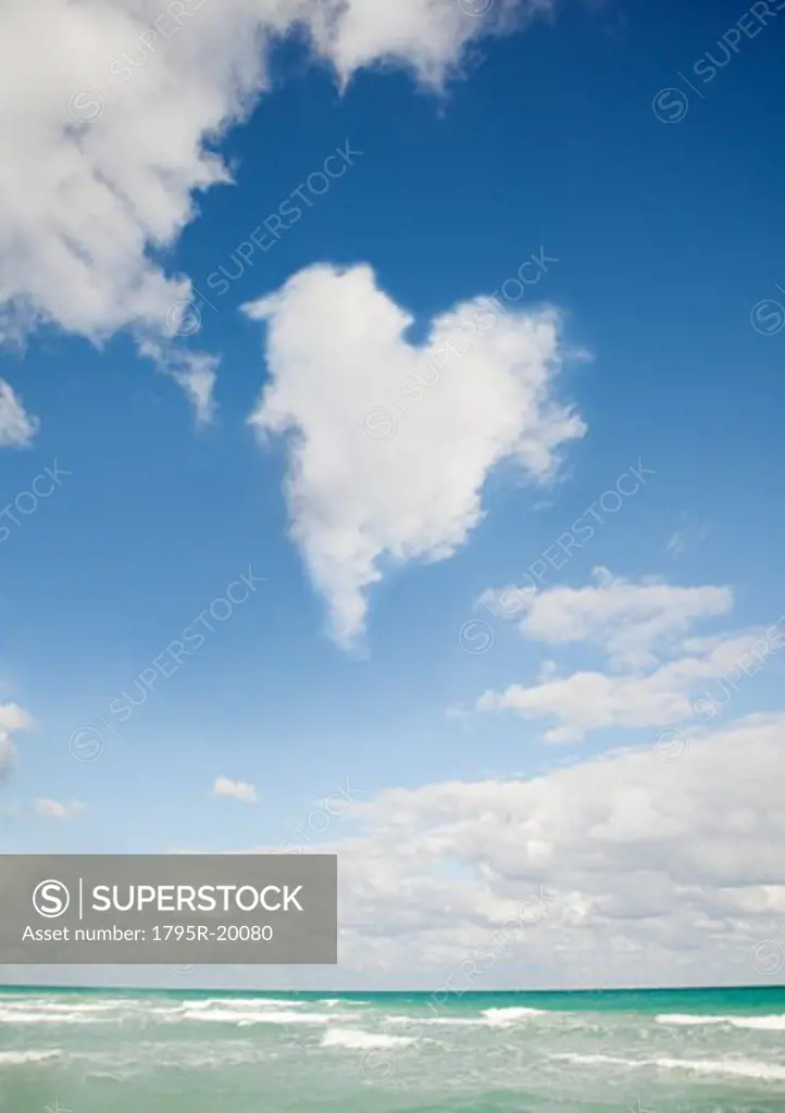 Heart shaped cloud over ocean
