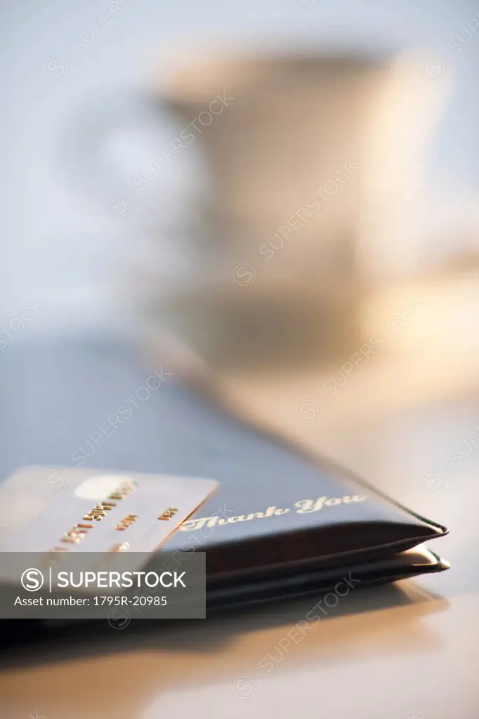 A credit card on a restaurant check