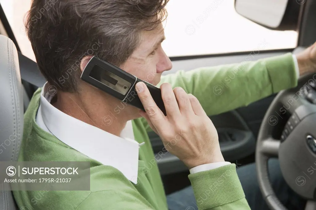Man using cellular phone while driving