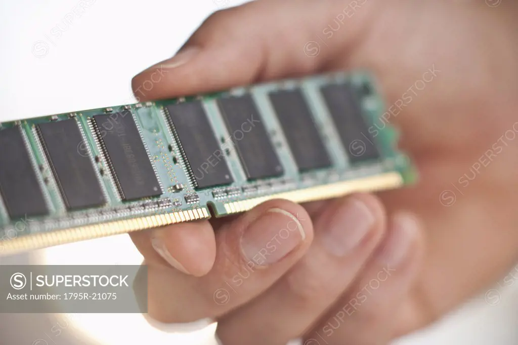 Hand holding computer chips