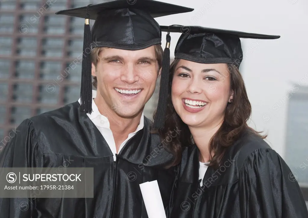 A young woman and young man graduating