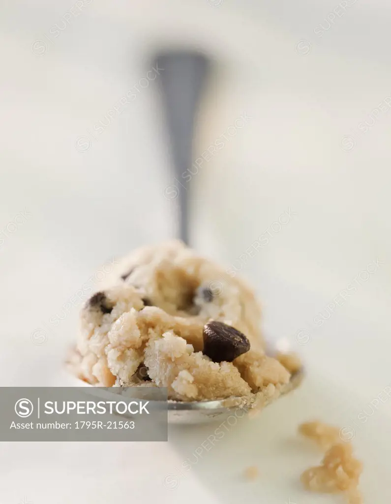 Chocolate chip cookie dough on a spoon