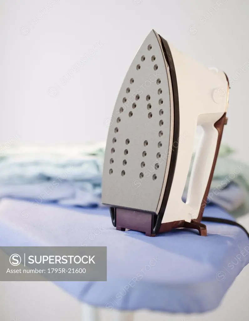 An iron on a ironing board