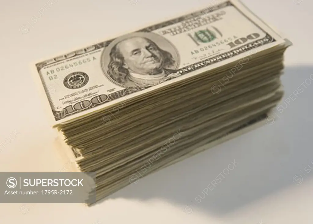 Tall stack of U.S. hundred dollar bills