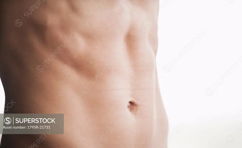 A man's shirtless abdomen