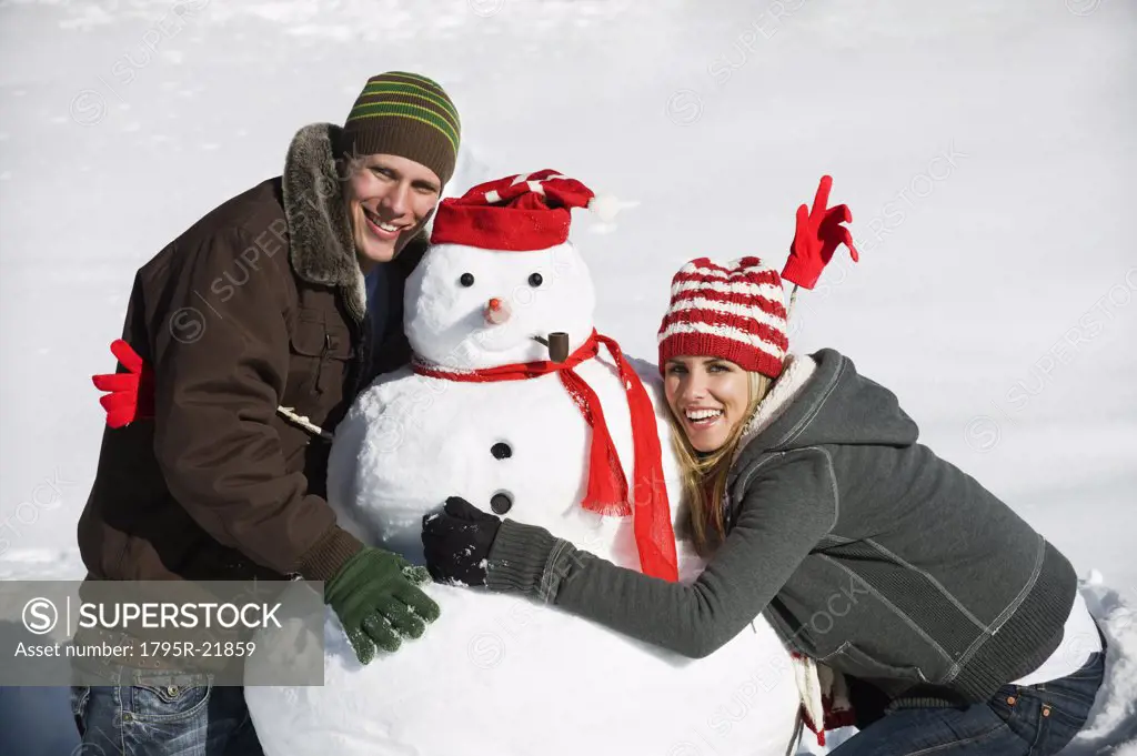 A couple making a snowman