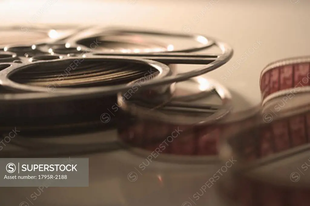 Closeup of film reel unrolling - SuperStock