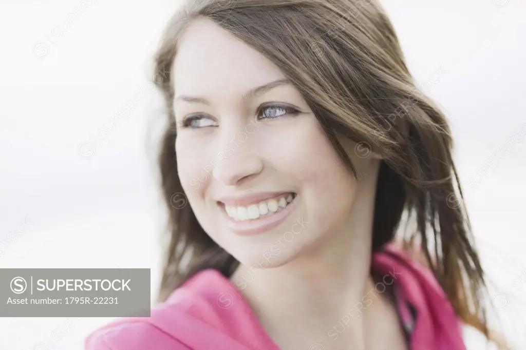 A young woman outdoors smiling