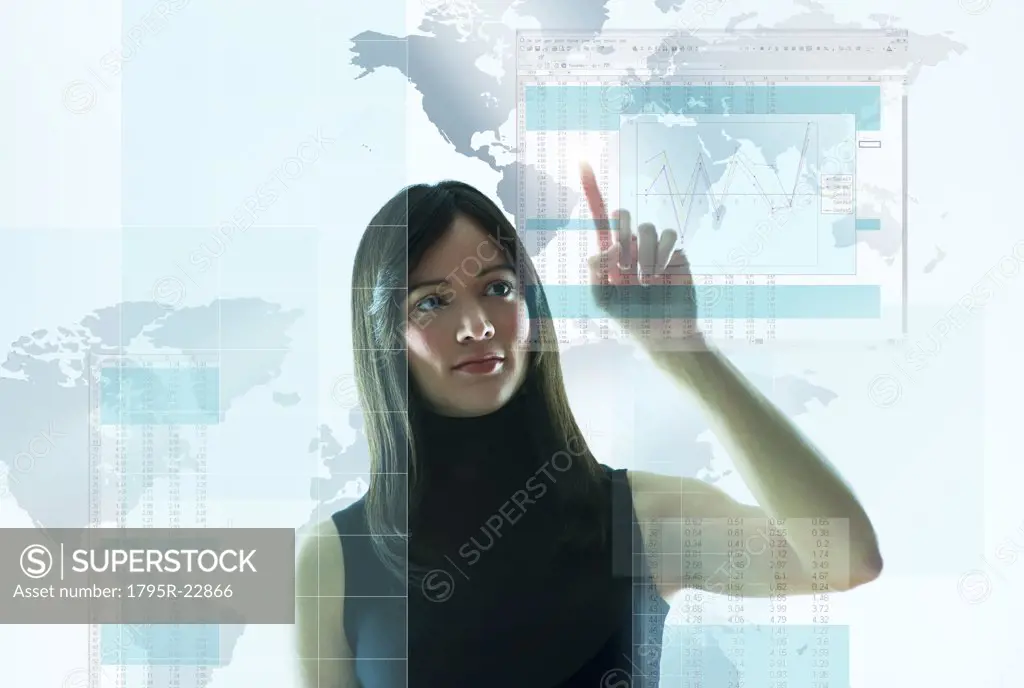 Mid-adult woman pointing on world map