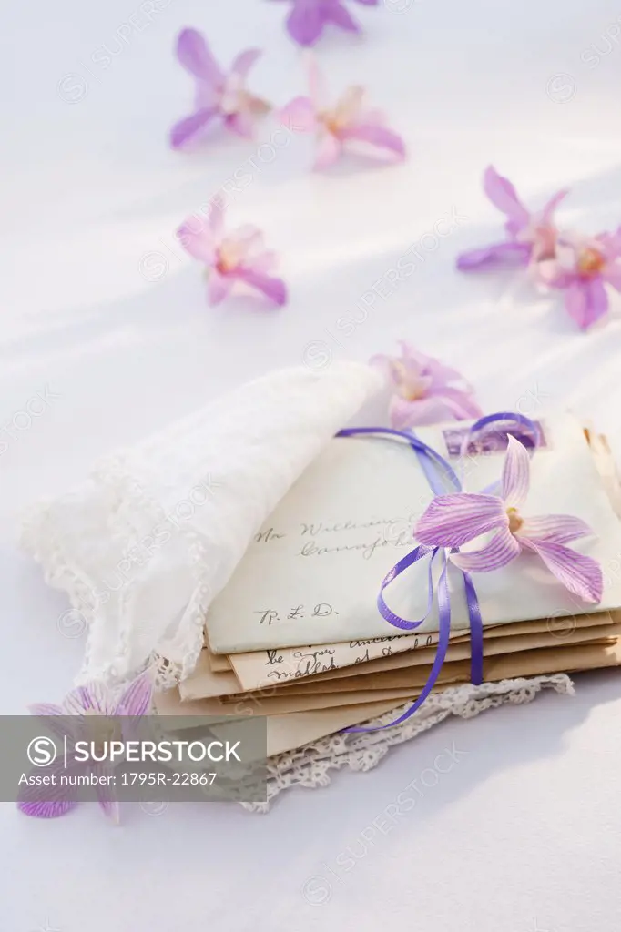 Old letters wrapped in handkerchief with flowers around