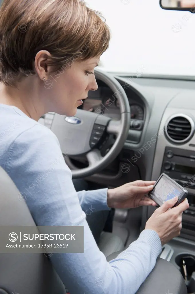 Woman in car with GPS