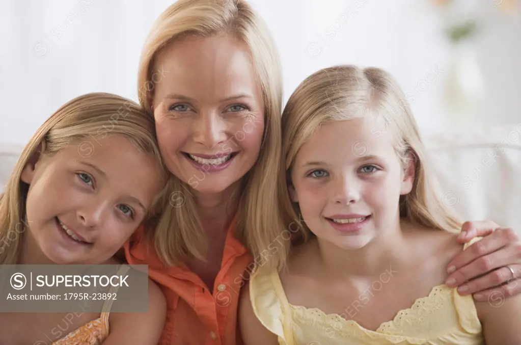 Mother and daughters at home