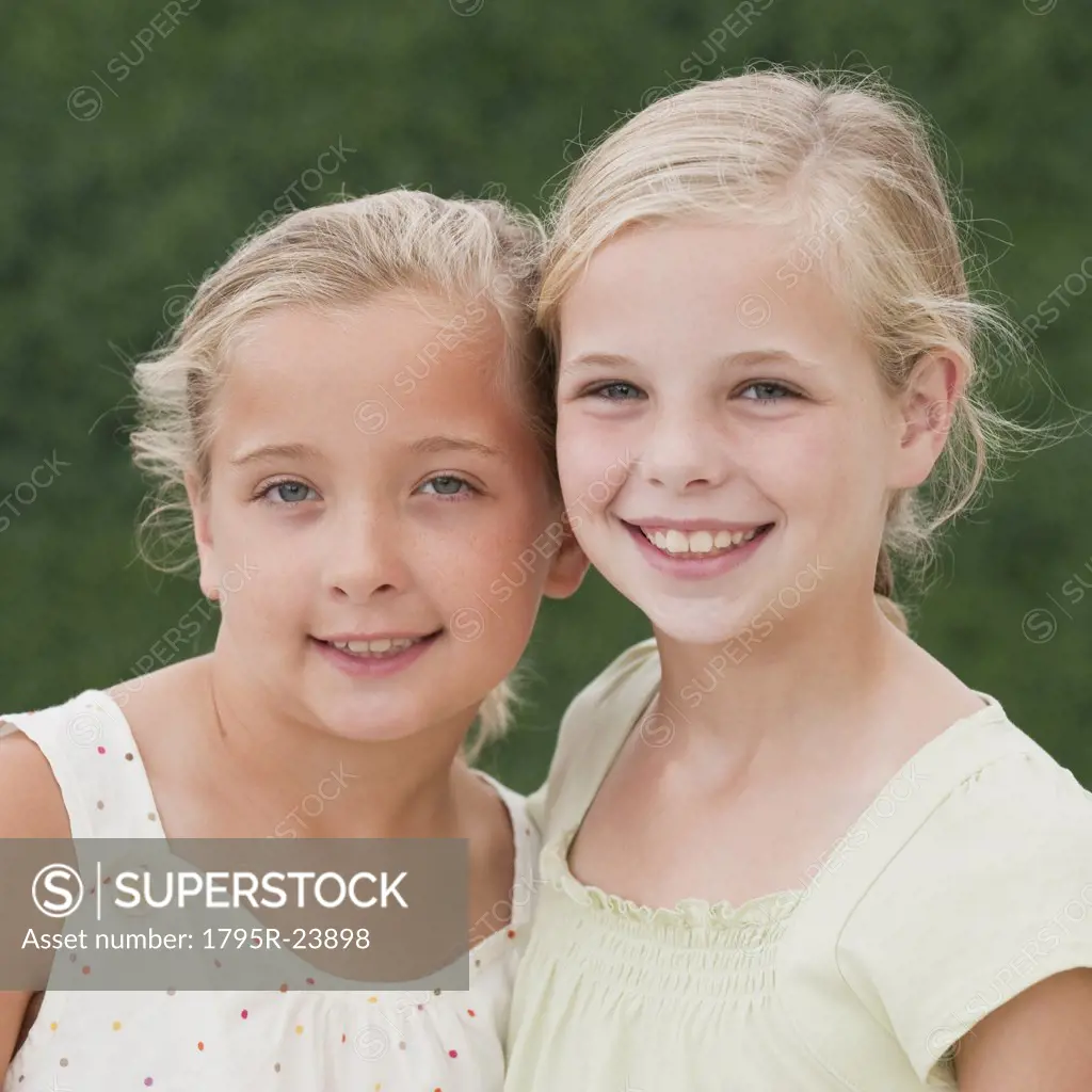 Young sisters smiling