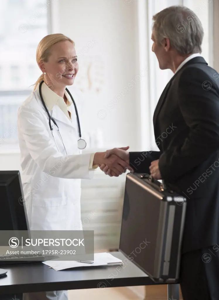 Female doctor greeting salesman