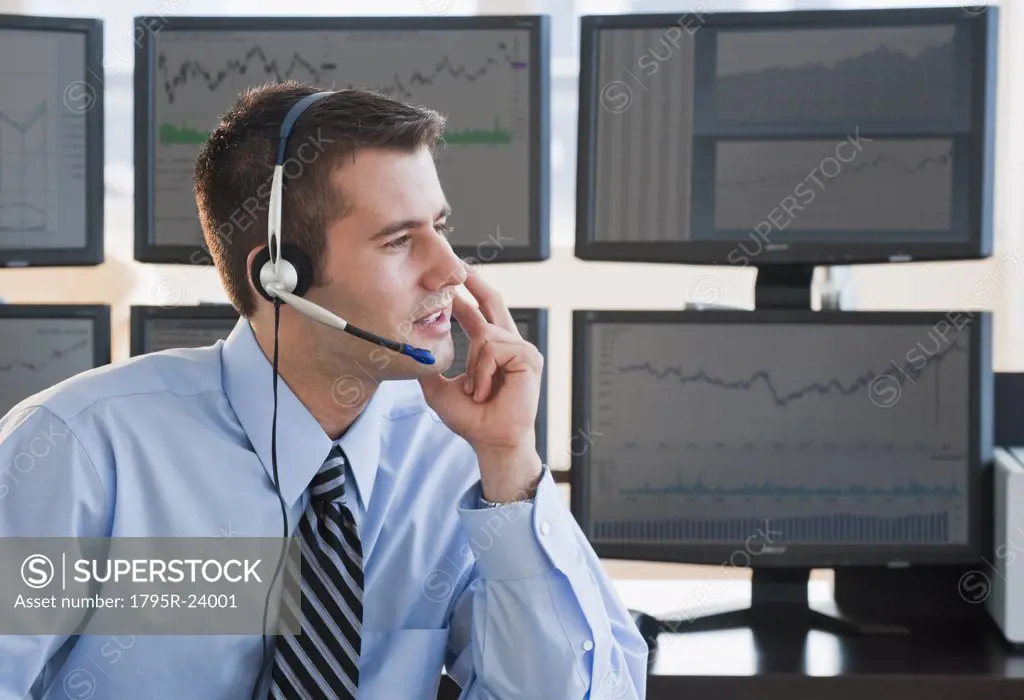 Male trader with headset