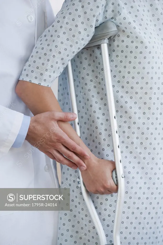 Doctor and patient with crutches