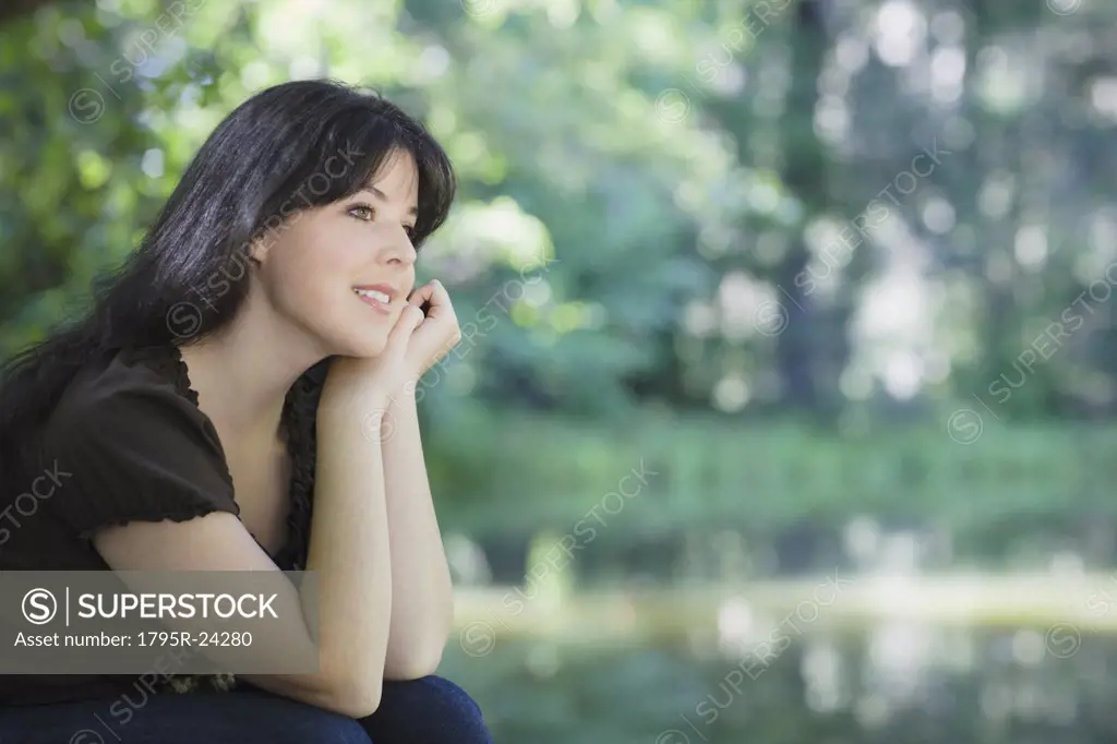 Young woman smiling in forest