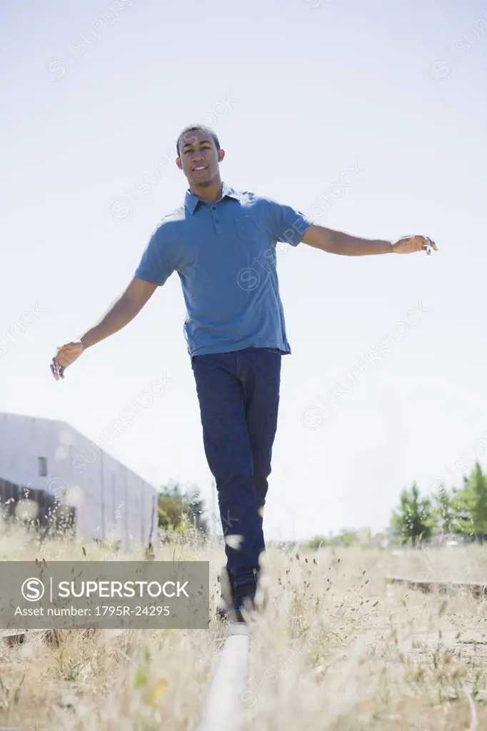 Young man on railroad track