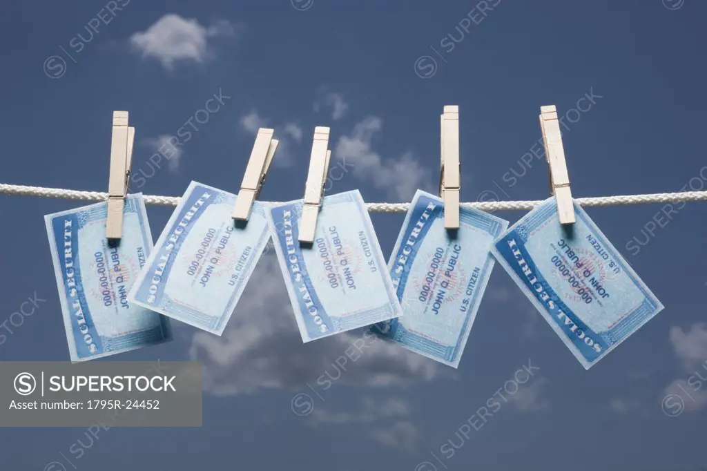 Social security cards on clothes line