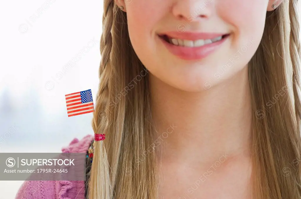 Young girl with American flag in hair