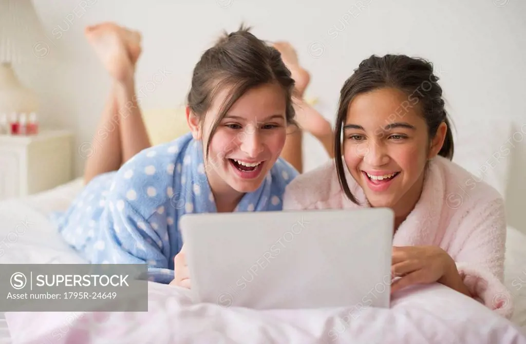 Girls looking at laptop