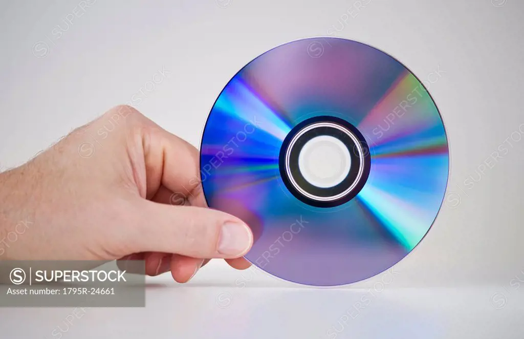 Hand holding compact disc