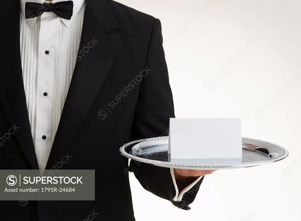 Butler holding silver tray