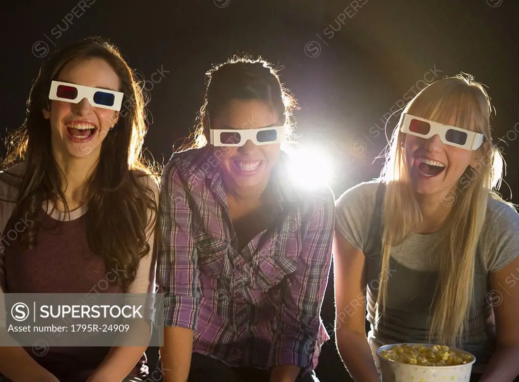 Young girls watching 3D movie