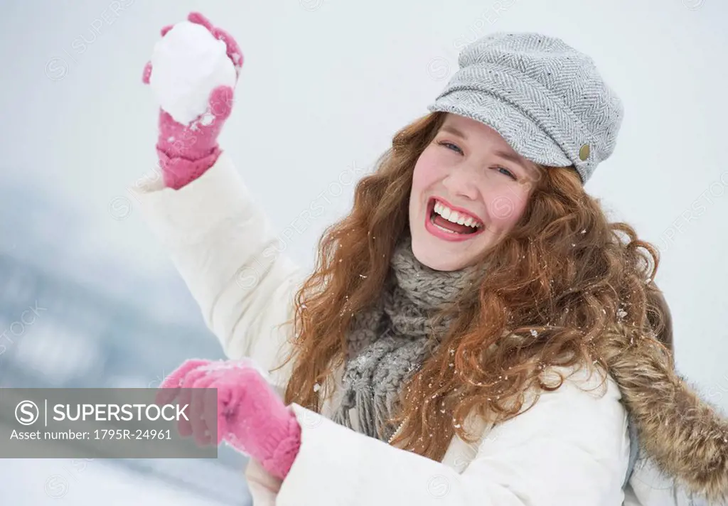 Woman throwing a snowball