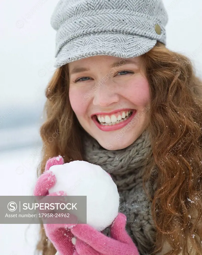 Woman holding a snowball