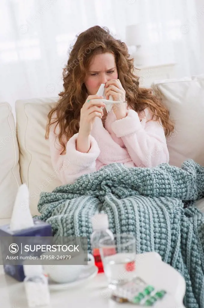 Sick woman on couch