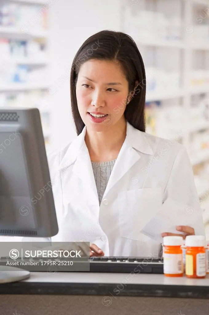 Pharmacist working on computer