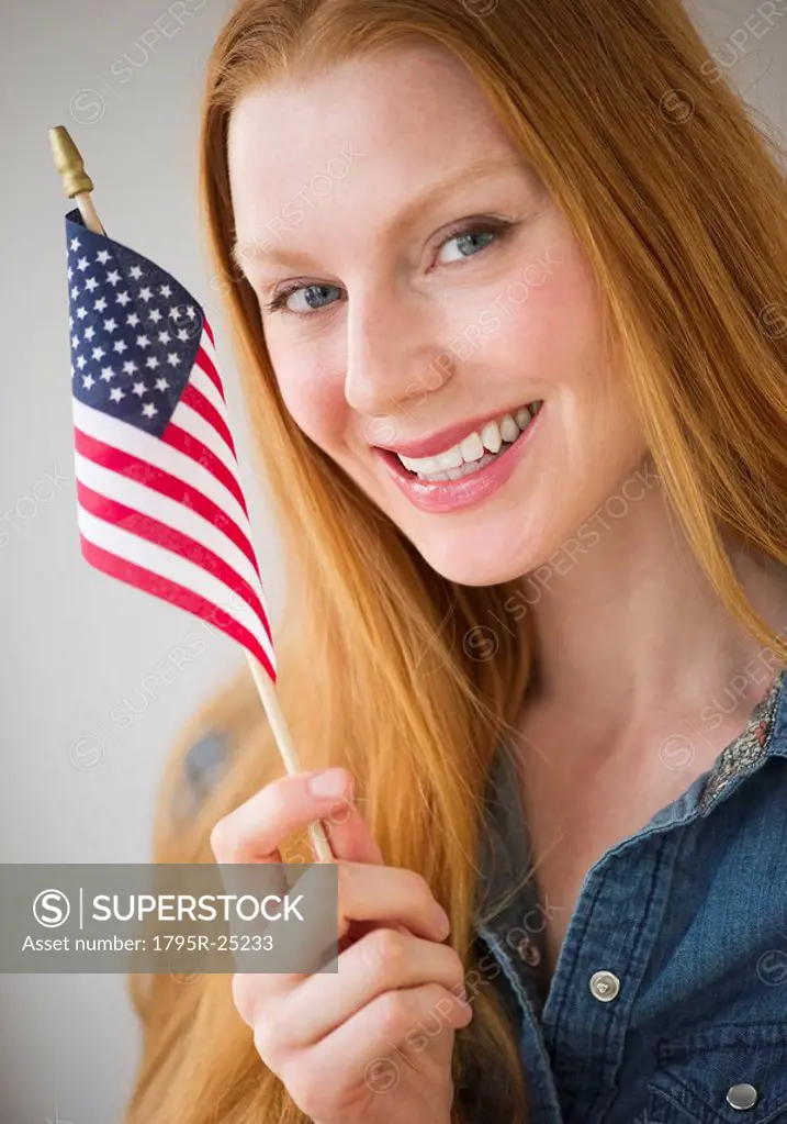 Woman holding American flag
