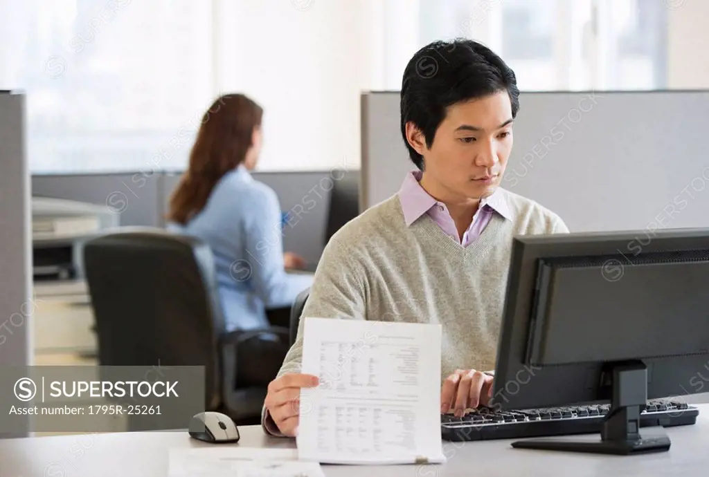 Man working in cubicle