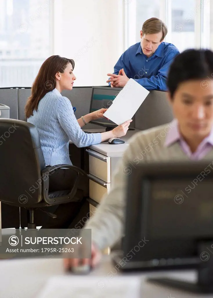 Office workers in cubicles