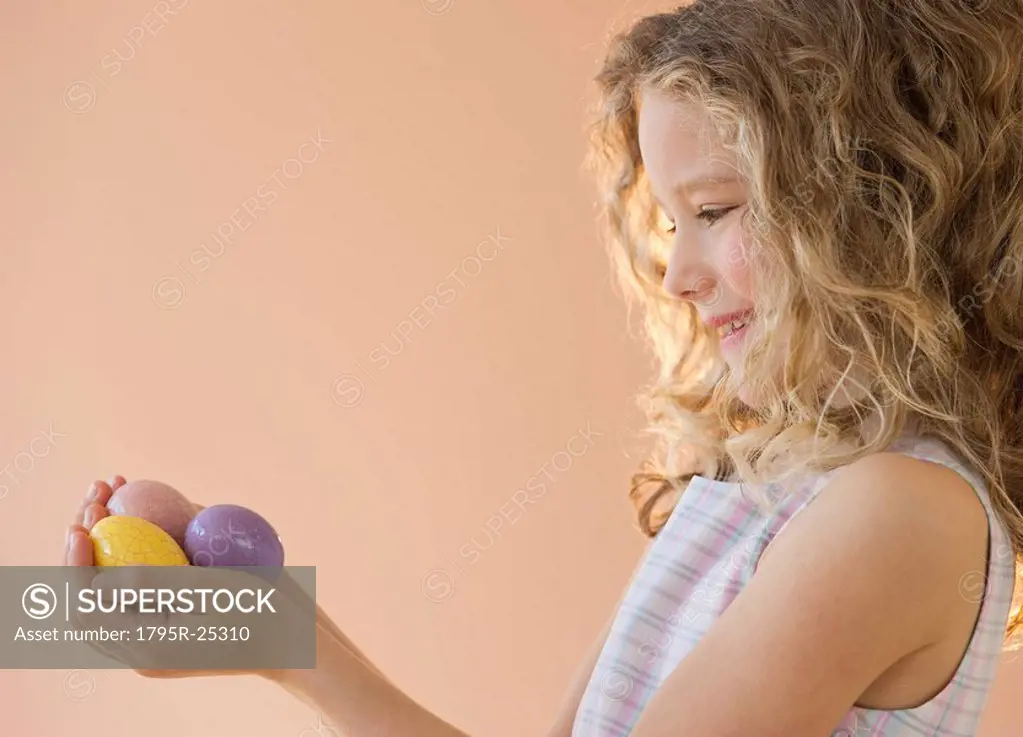 Young girl holding Easter eggs