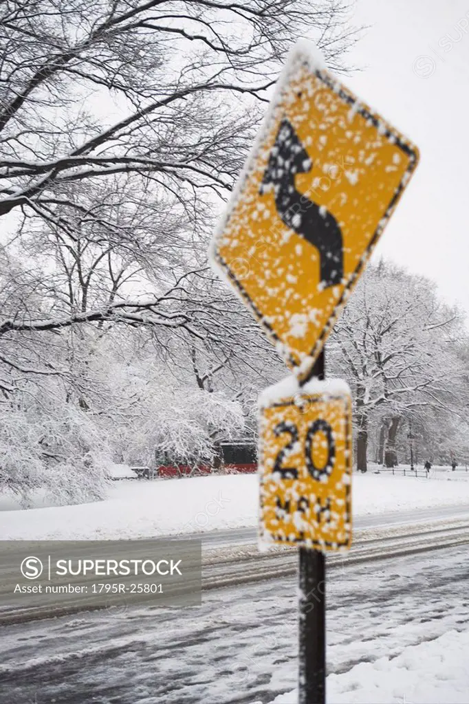 Speed limit sign covered in snow