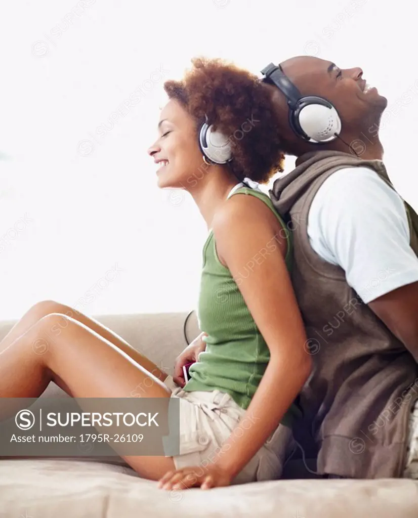 Couple wearing headphones