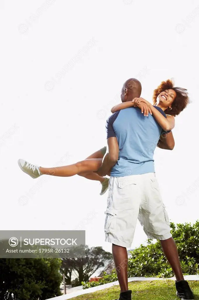 Man carrying woman