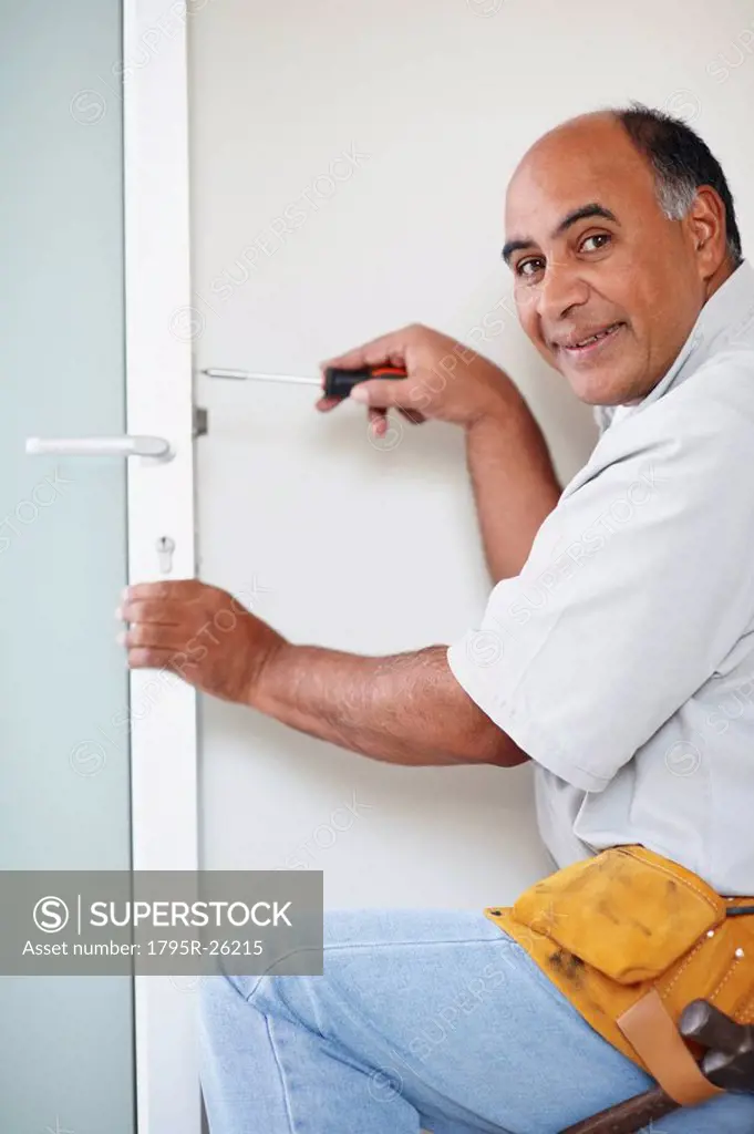 Man fixing door