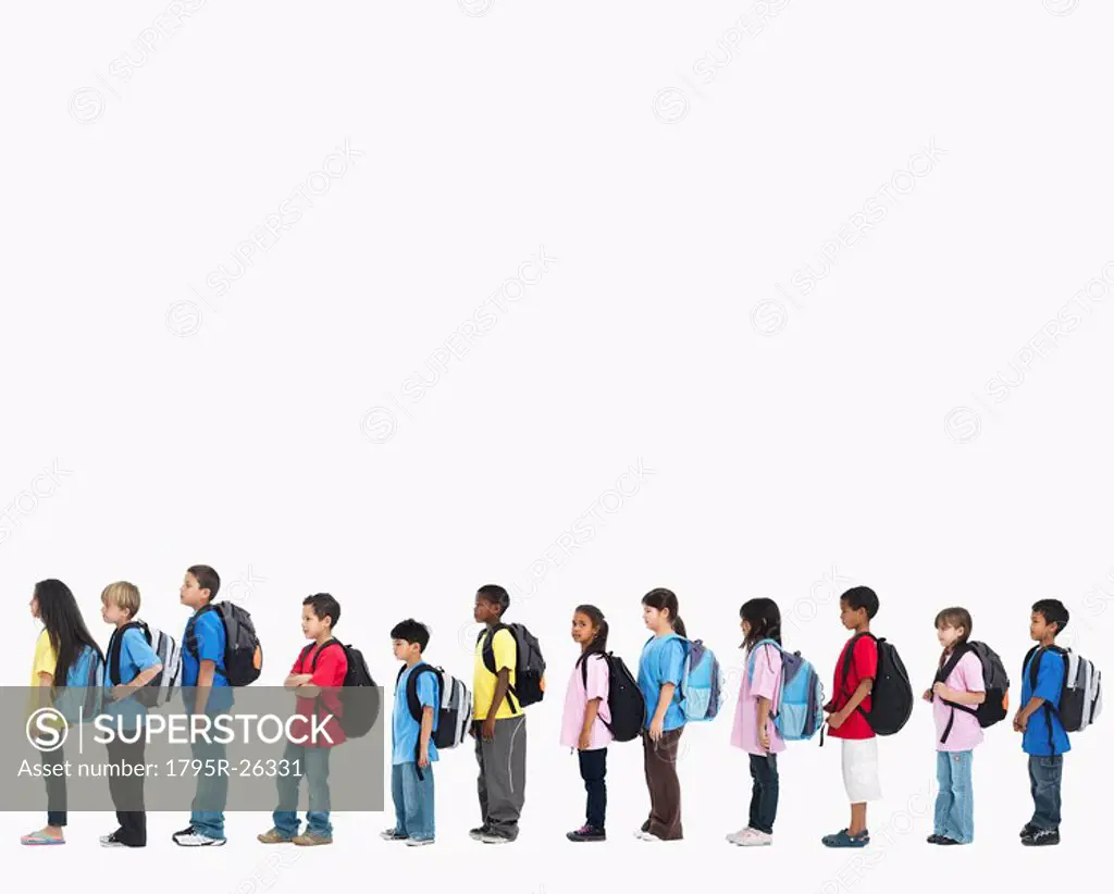 Line of children wearing backpacks