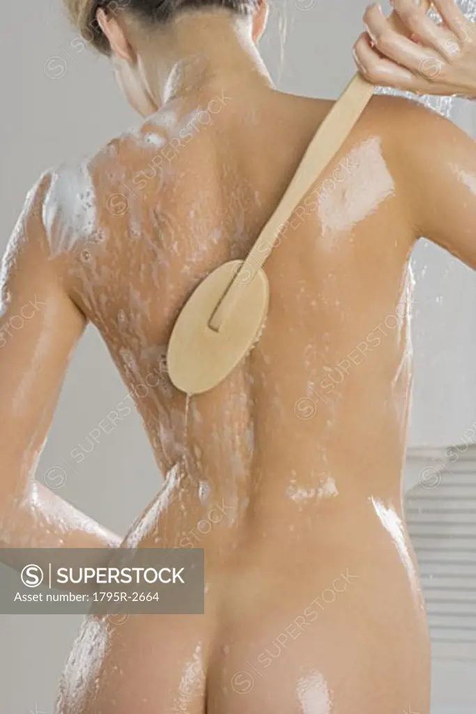 Rear view of woman bathing