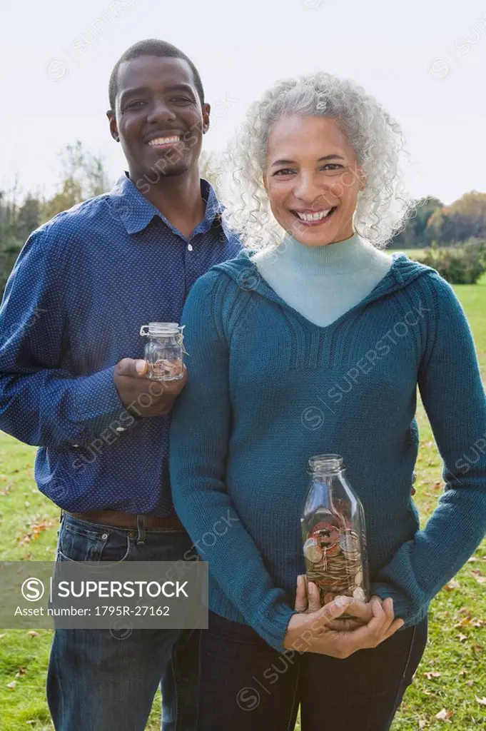 Couple holding jars