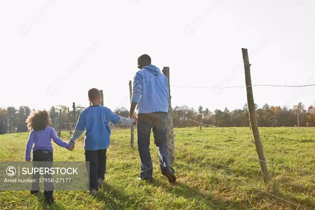 Father and children walking