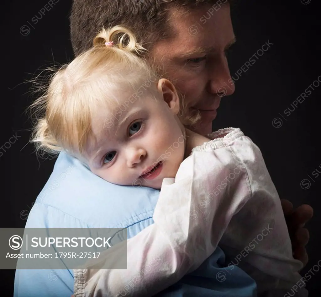 Daughter hugging father